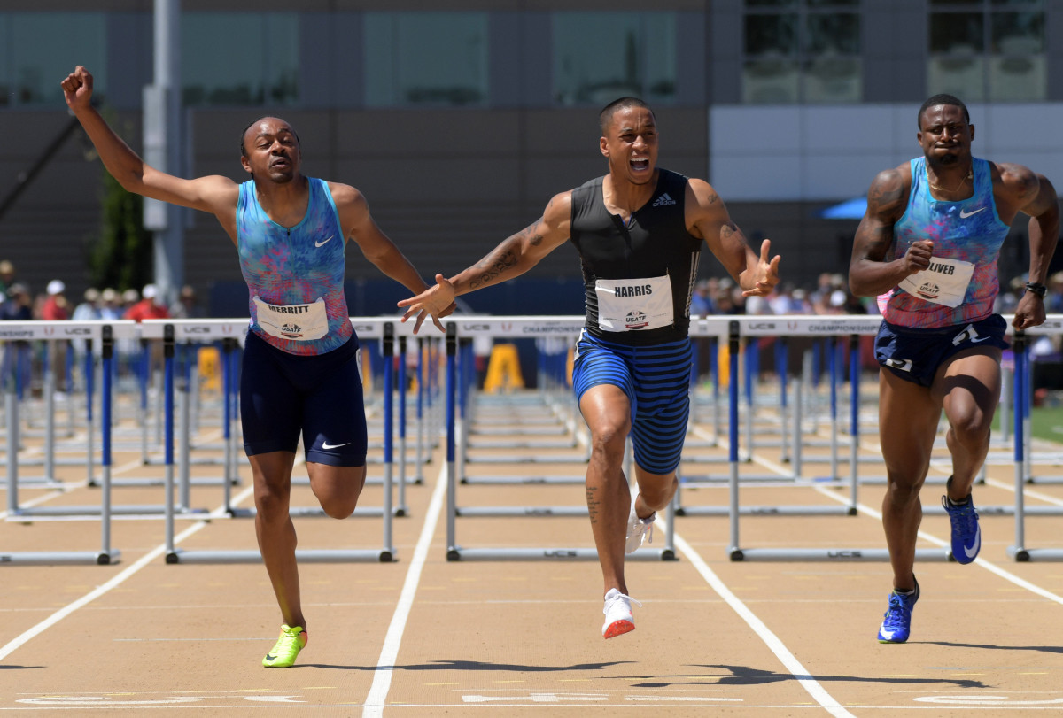 Sacramento, CA, USA; Aleec Harris (center) celebrates after defeating Aries Merritt (left) to win the 110m hurdles, 13.24 to 13.31, during the USA Track and Field Championships at Hornet Stadium. David Oliver (right) was fifth in 13.51. Mandatory Credit: Kirby Lee